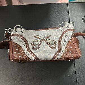 Western studded shoulder bag gray and tan featuring metal pistol design purse